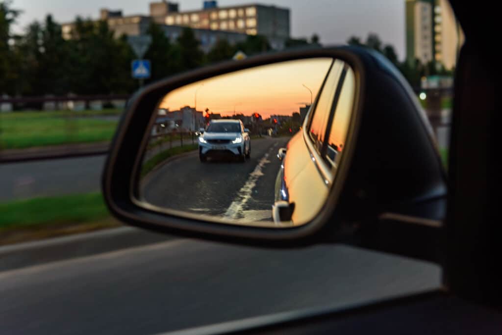 Overtaking car in the rearview mirror