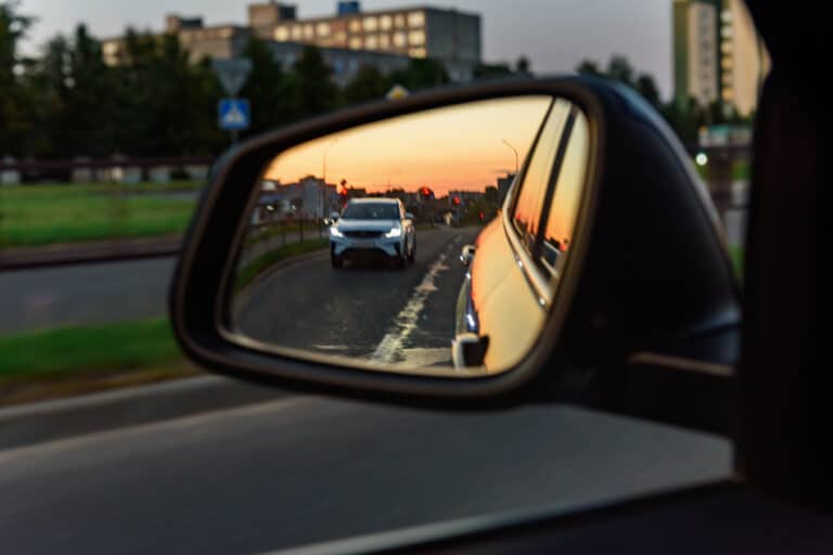 Overtaking car in the rearview mirror
